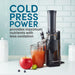 COLD PRESS POWER provides maximum nutrients with less oxidation. Elite Gourmet juicer with extracted apple juice in the kitchen.