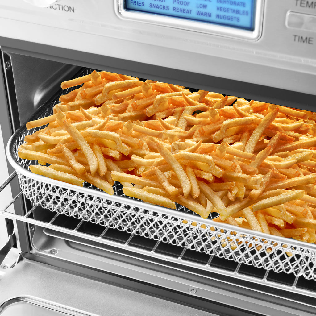 Close up image of air frying basket full of golden fries.