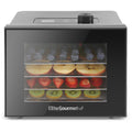 Electric Food Dehydrator with blueberries, apple slices, strawberries and kiwi drying inside.