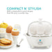 Compact N' Stylish with a beautiful round shape that fits any counter top.  Egg cooker next to cooked eggs, fruit and toast.