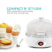 Compact N' Stylish with a beautiful round shape that fits any counter top. Egg cooker next to cooked eggs, fruit and toast.