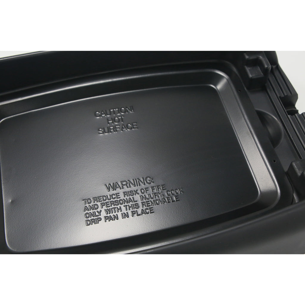 Showing non-stick pan surface of electric indoor grill. Caution : Hot Surface. Warning : To reduce risk of fire and personal injury, cook only with this removable drip pan in place.