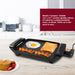 Electric Compact Griddle: 10.6" × 8.7" nonstick griddle surface. It is ideal for cooking breakfast, lunch, or dinner. Clean up is also quick & easy. Grill putting on the table in the kitchen,