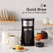 compact coffee maker with cookies and muffins around it. Quick brew up to 14oz. of fresh coffee.