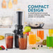 Elite Gourmet slow juicer with extracted colorful glass of juices.