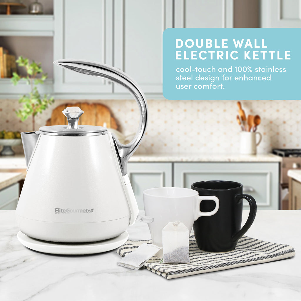 DOUBLE WALL ELECTRIC KETTLE cool-touch and 100% stainless steel design for enhanced user comfort. Kettle on the table with coffee cups
