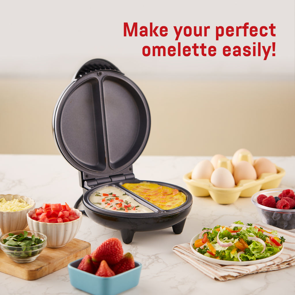 Make your perfect omelette easily! Omelette maker surrounded by ingredients on kitchen counter.