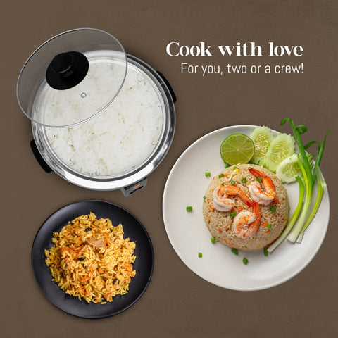Cook with love.  For you, two or a crew!  Above view of rice cooker with cooked rice, next to plates of fried rice and curry rice.