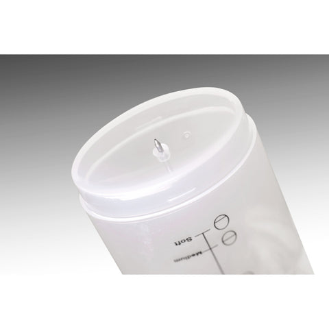 Underside of measuring cup with piercing pin.
