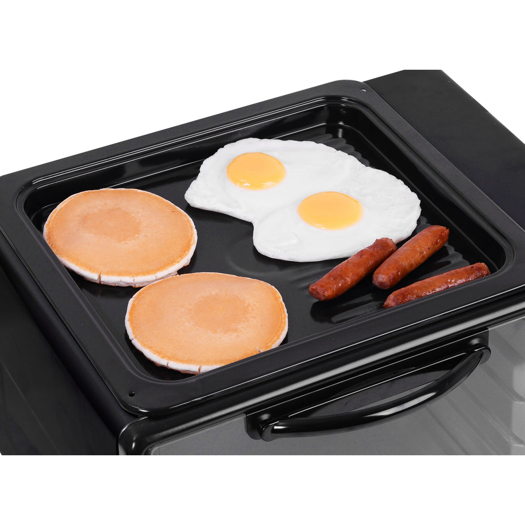 Image of top grill & griddle with pancakes, eggs, and sausages on top.